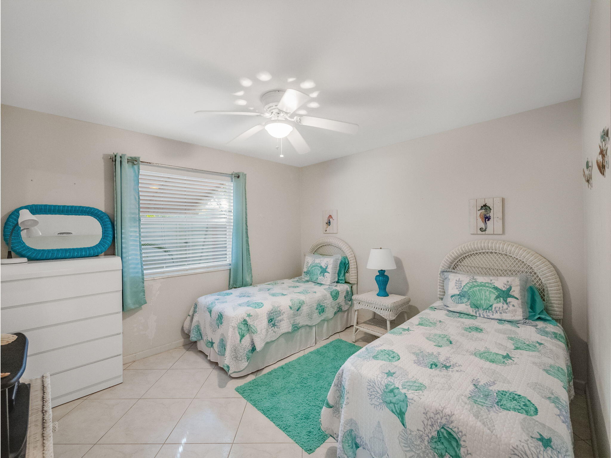 1196 Coral Way Singer Island, FL 33404 - Photo 11 of 17 a bedroom with two beds and a window