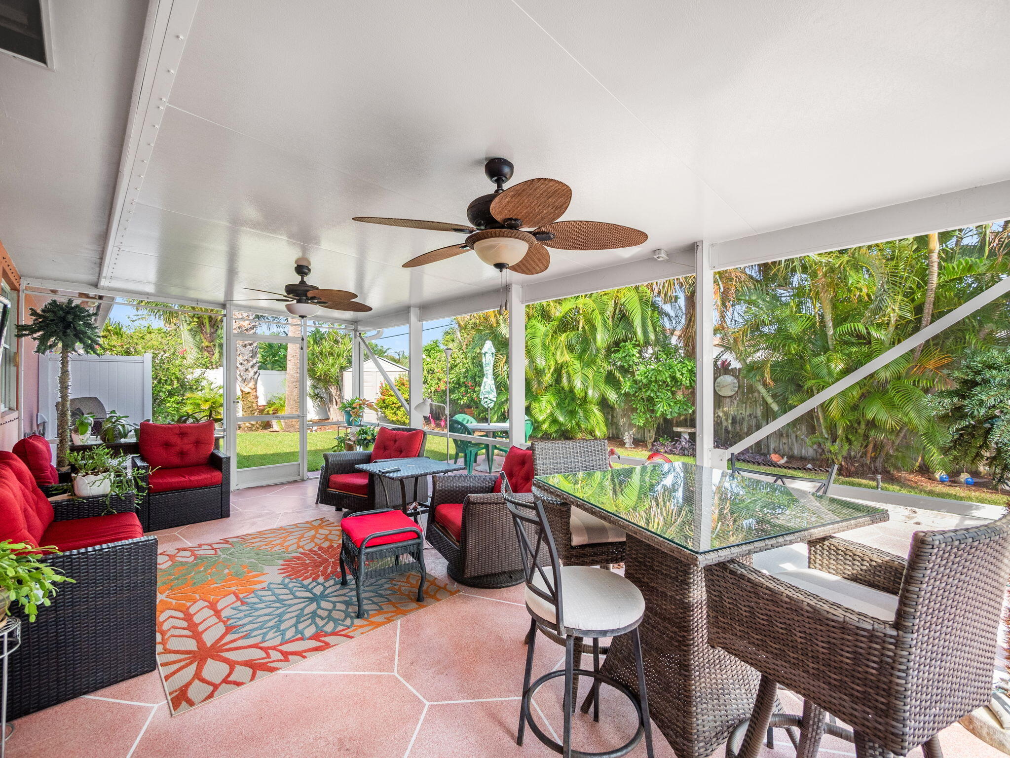 1196 Coral Way Singer Island, FL 33404 - Photo 13 of 17 a living room with patio furniture and a floor to ceiling window