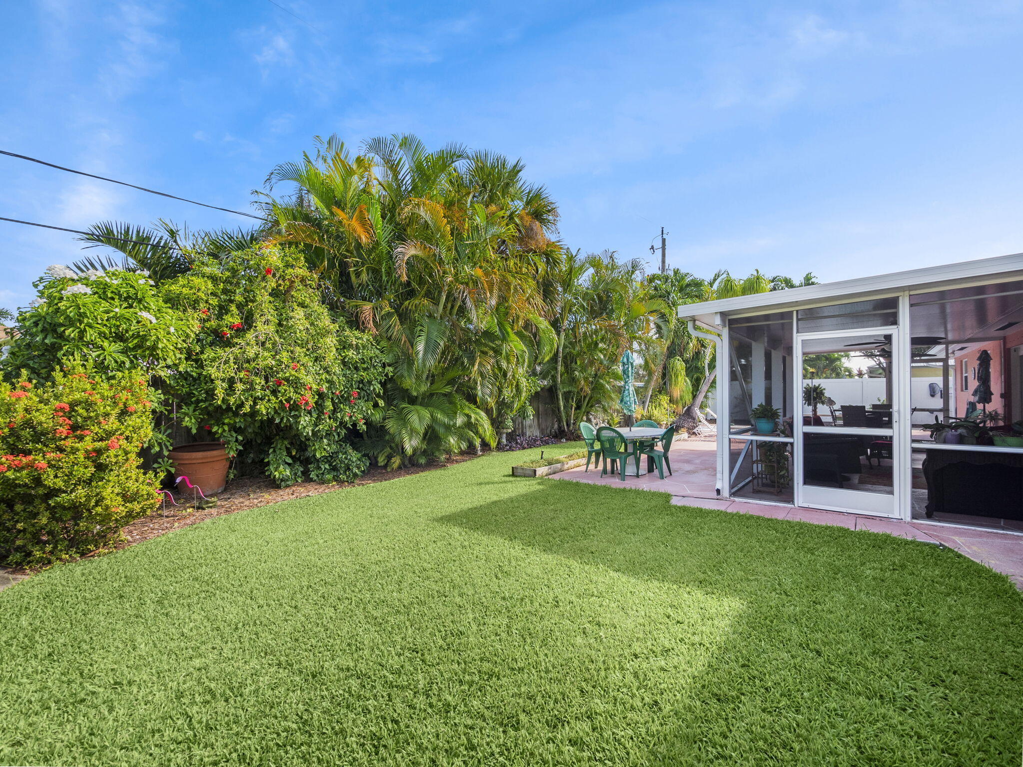 1196 Coral Way Singer Island, FL 33404 - Photo 14 of 17 a view of a house with a yard porch and sitting area