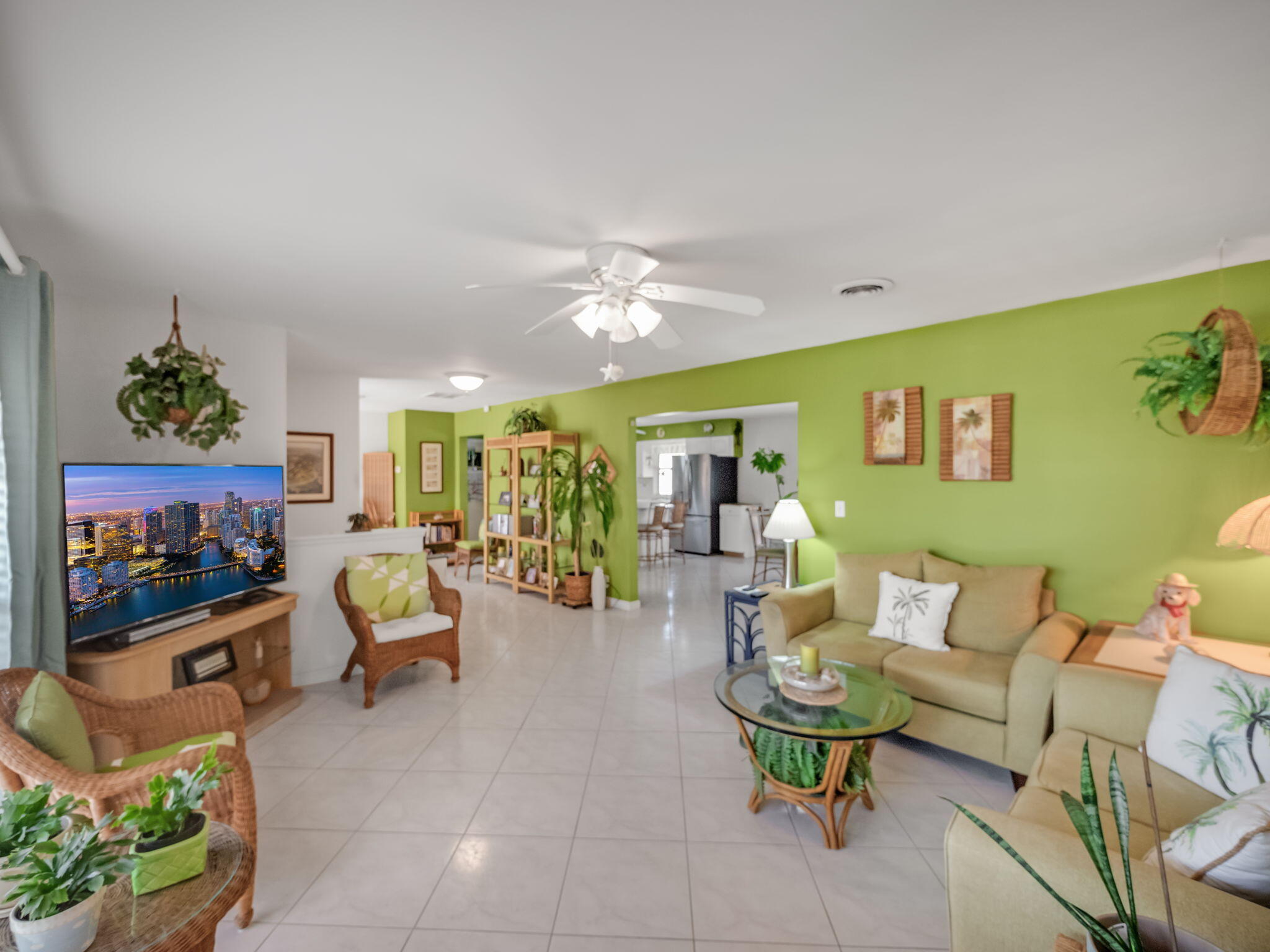 1196 Coral Way Singer Island, FL 33404 - Photo 4 of 17 a living room with furniture and a flat screen tv