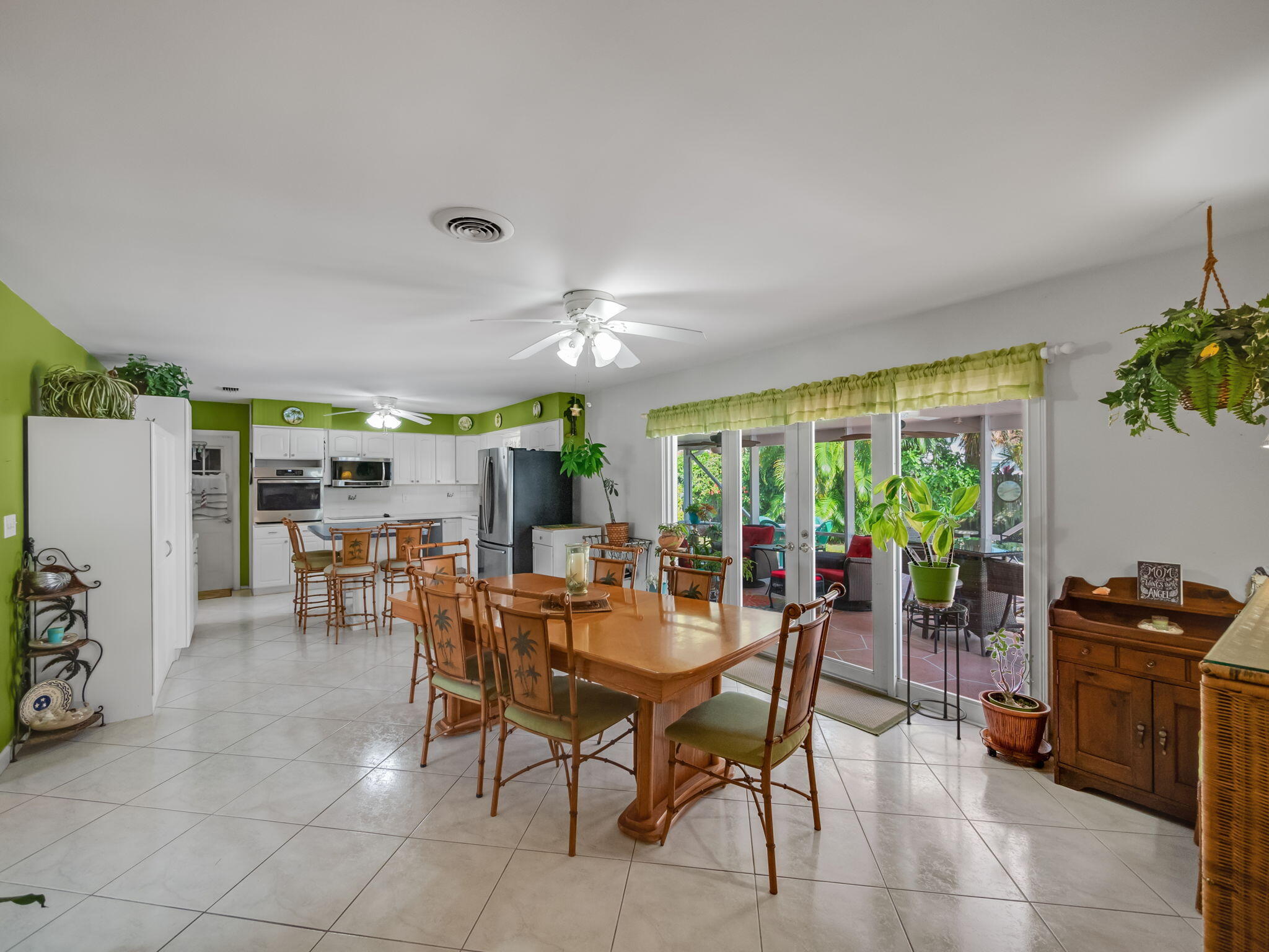 1196 Coral Way Singer Island, FL 33404 - Photo 5 of 17 a view of a dining room with furniture window and outside view