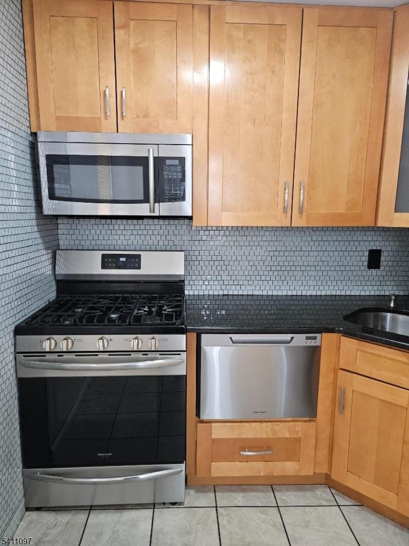 19 Savage Road, Unit 32D8 Denville, NJ 07834 - Photo 12 of 19 a kitchen with granite countertop cabinets stainless steel appliances and wooden floor