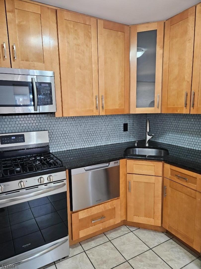 19 Savage Road, Unit 32D8 Denville, NJ 07834 - Photo 13 of 19 a kitchen with granite countertop cabinets and stainless steel appliances
