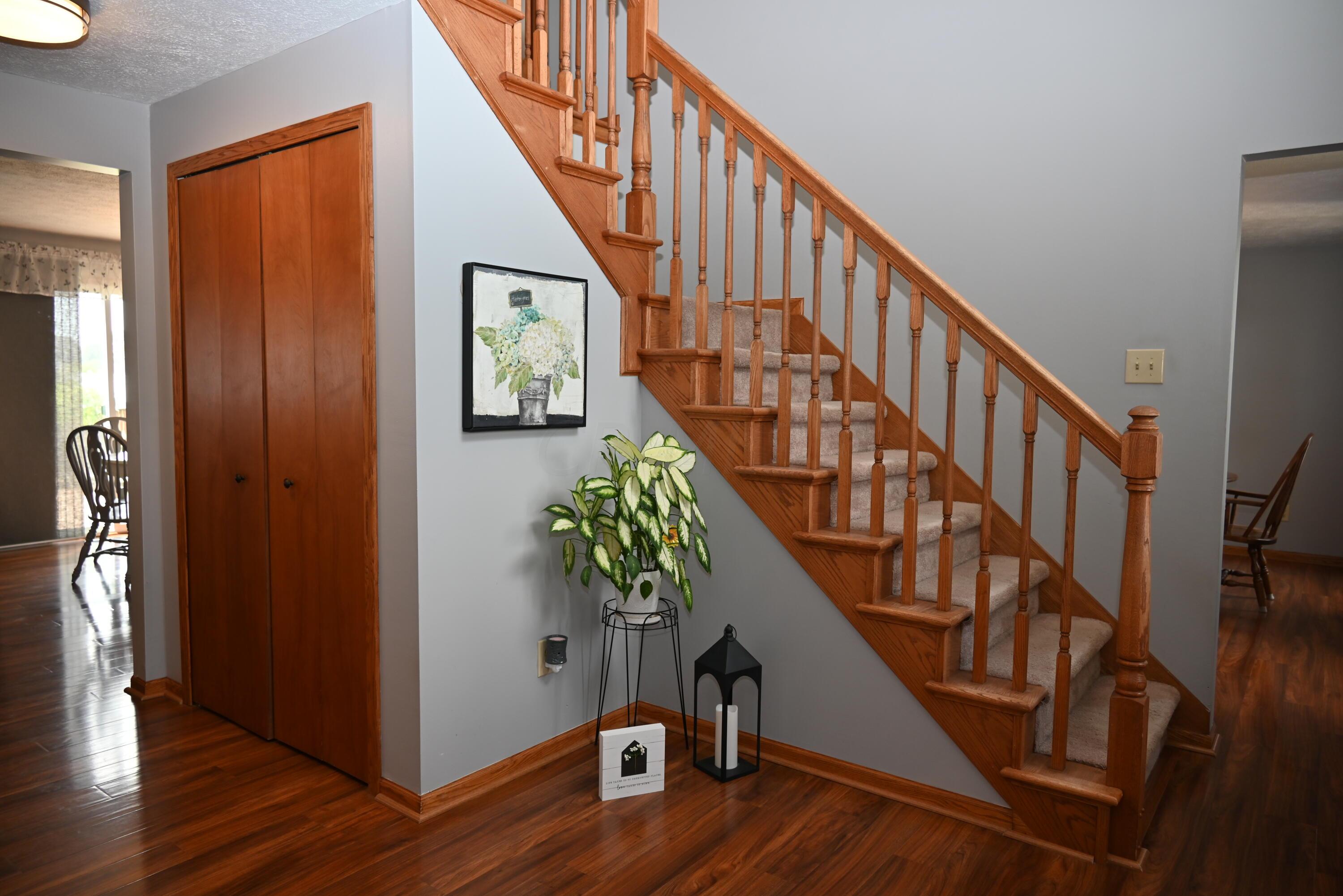 3305 Gooding Road Marion, OH 43302 - Photo 12 of 85 Oak staircase and coat closet in entrance.
