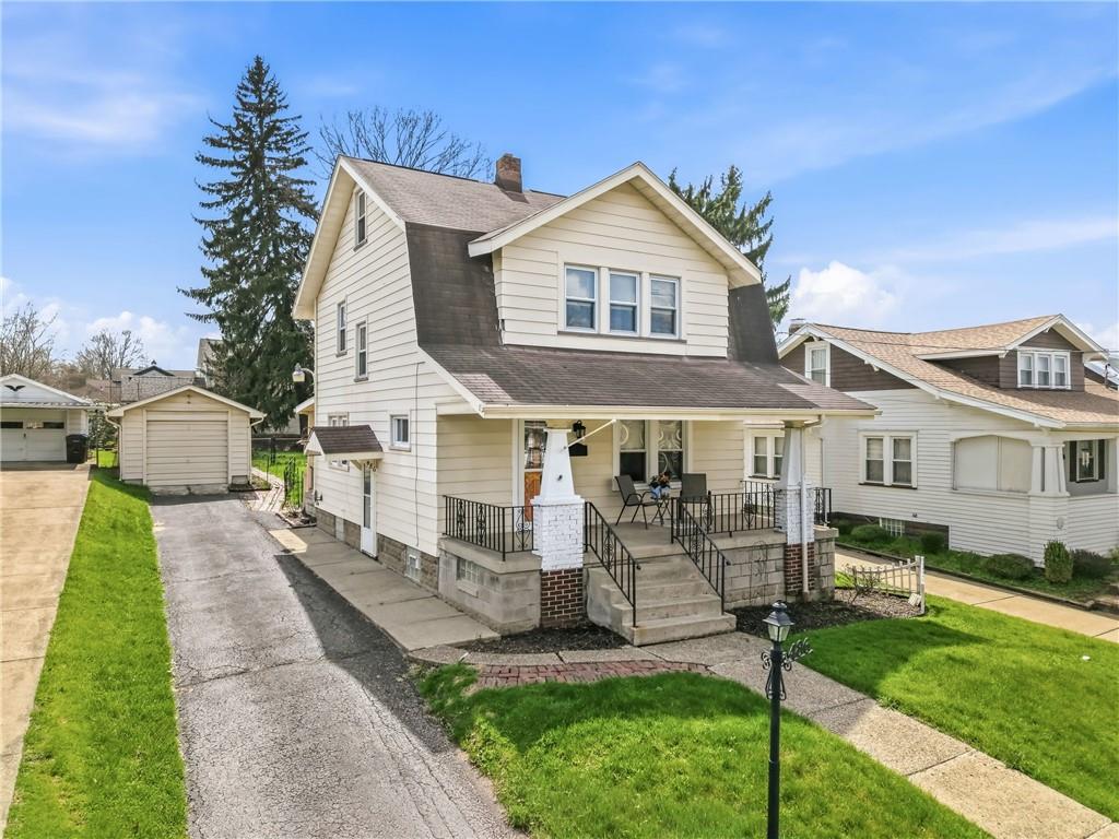 486 Tamplin Street Sharon, PA 16146 - Photo 1 of 32 a front view of a house with a yard