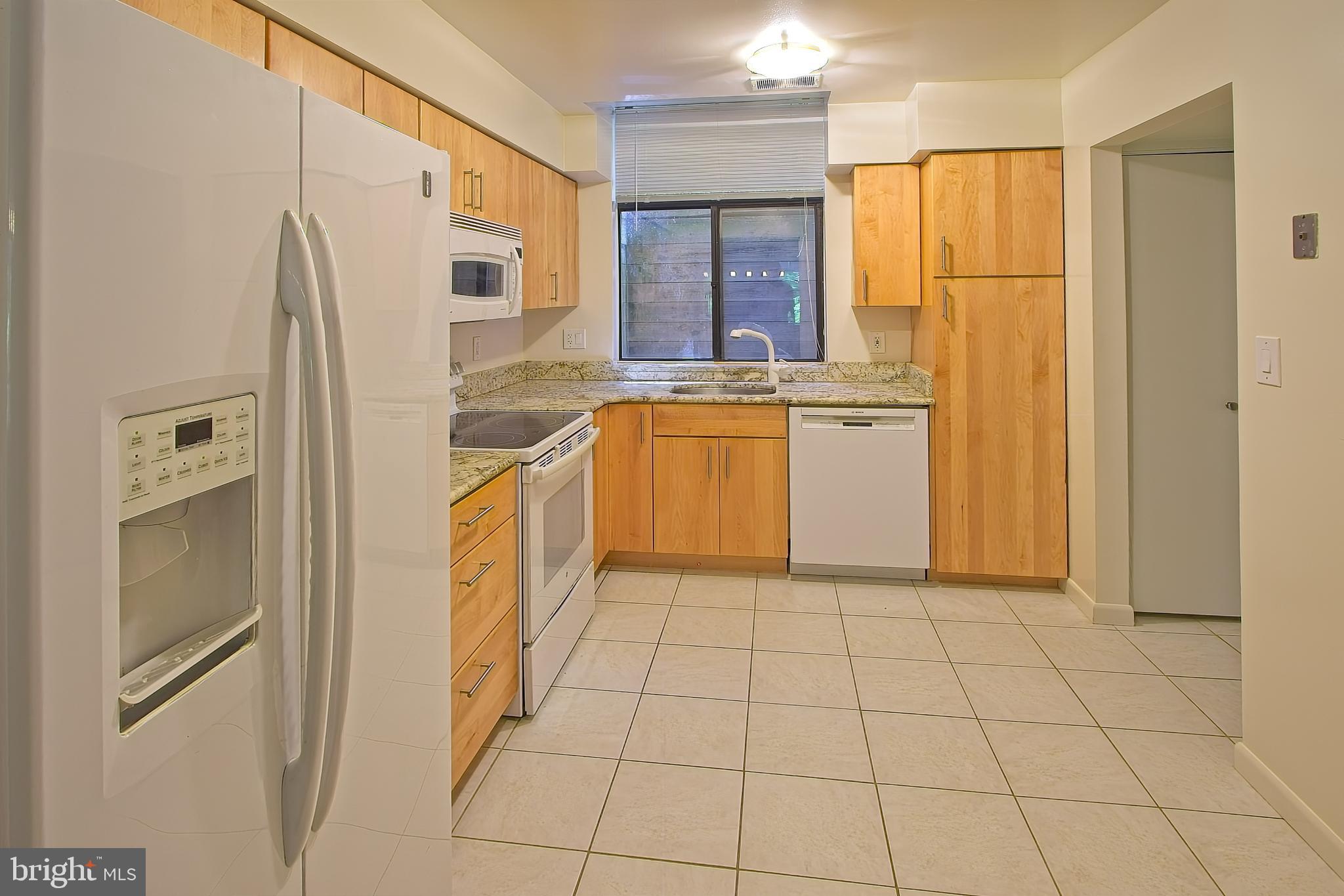 11108 Boathouse Court, Unit 97 Reston, VA 20191 - Photo 12 of 28 Pantry cabinet beside the dishwasher