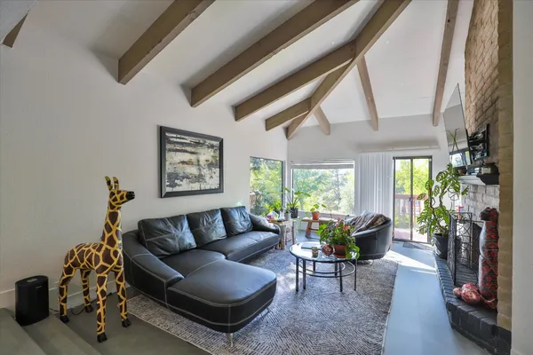 a bathroom with a granite countertop sink mirror and shower