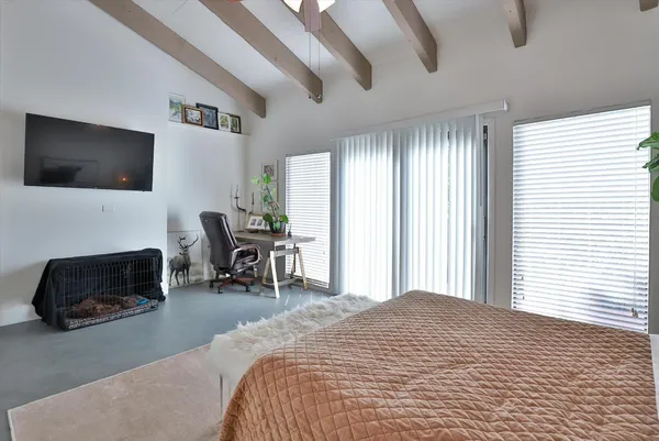a view of a patio with table and chairs potted plants and a large tree