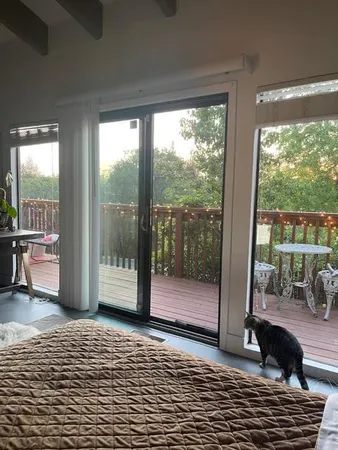 a view of balcony with wooden floor and outdoor seating