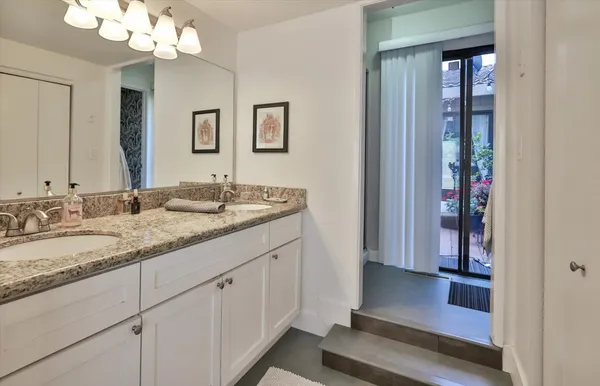 an aerial view of multiple houses with yard