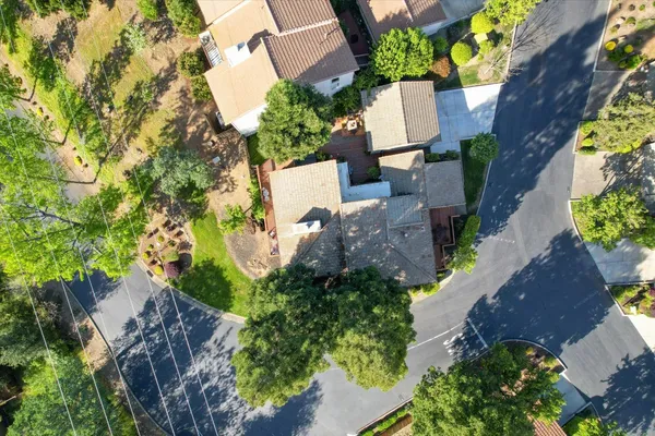 an aerial view of residential houses with outdoor space