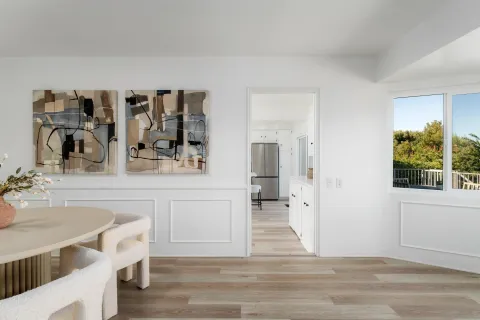 a spacious bathroom with a double vanity sink and a mirror