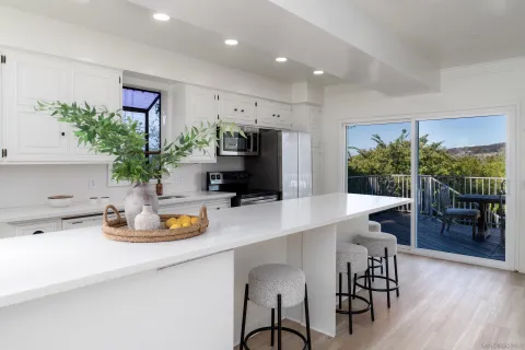 a kitchen with a table and chairs in it