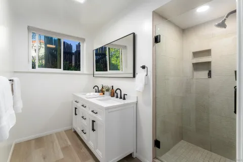 a bathroom with a sink and a window