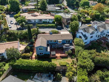 an aerial view of a house with yard swimming pool and outdoor seating