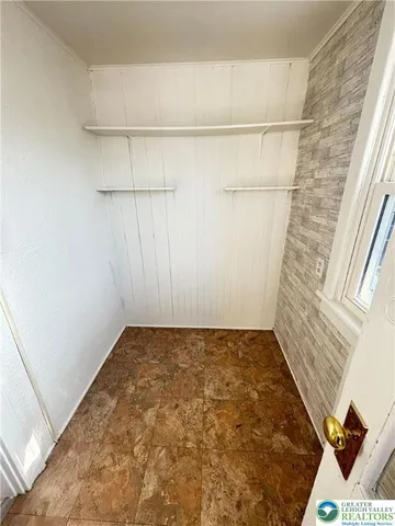 an empty room with an entryway