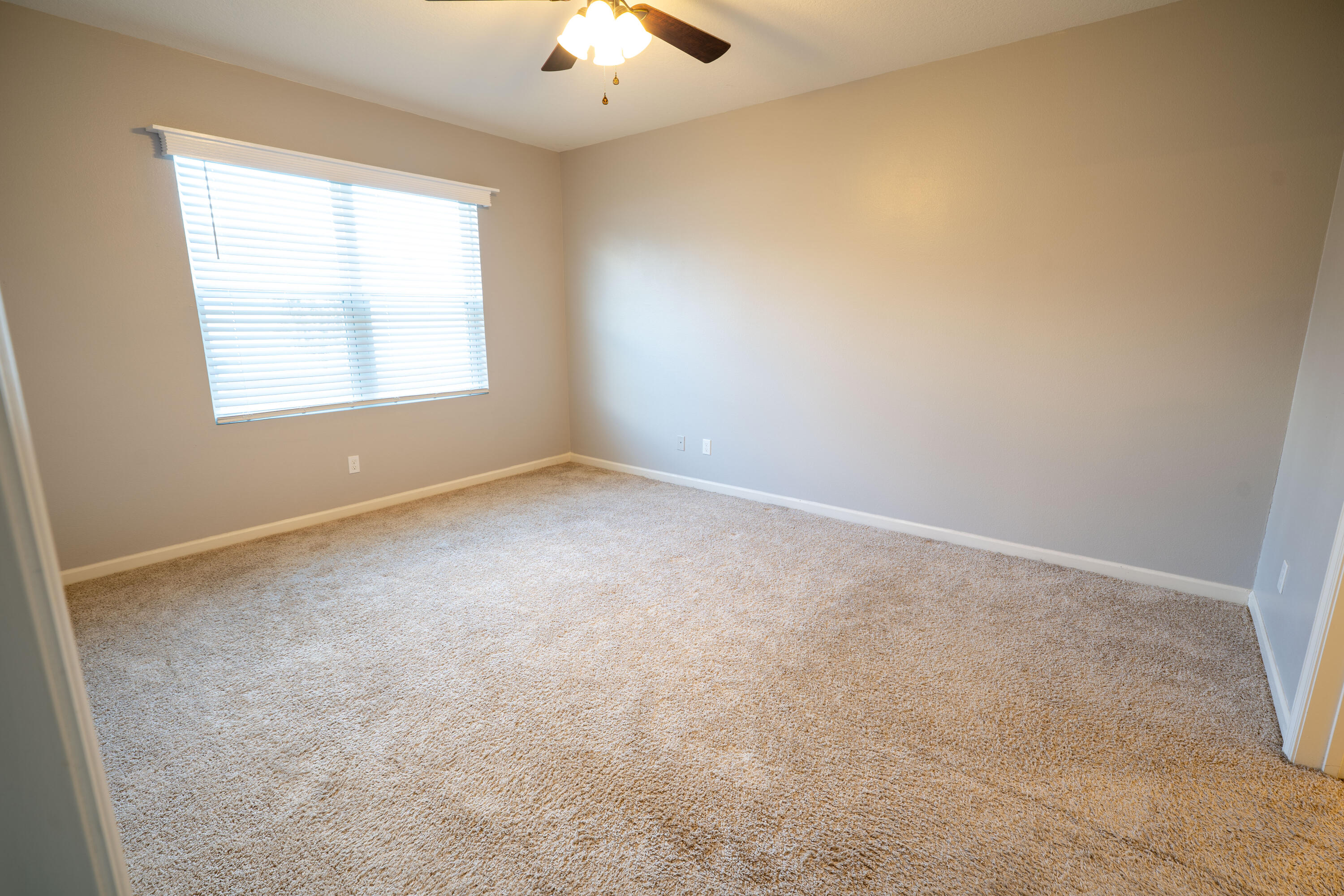 1401 Southeast Portillo Road Port St. Lucie, FL 34952 - Photo 18 of 37 an empty room with a window