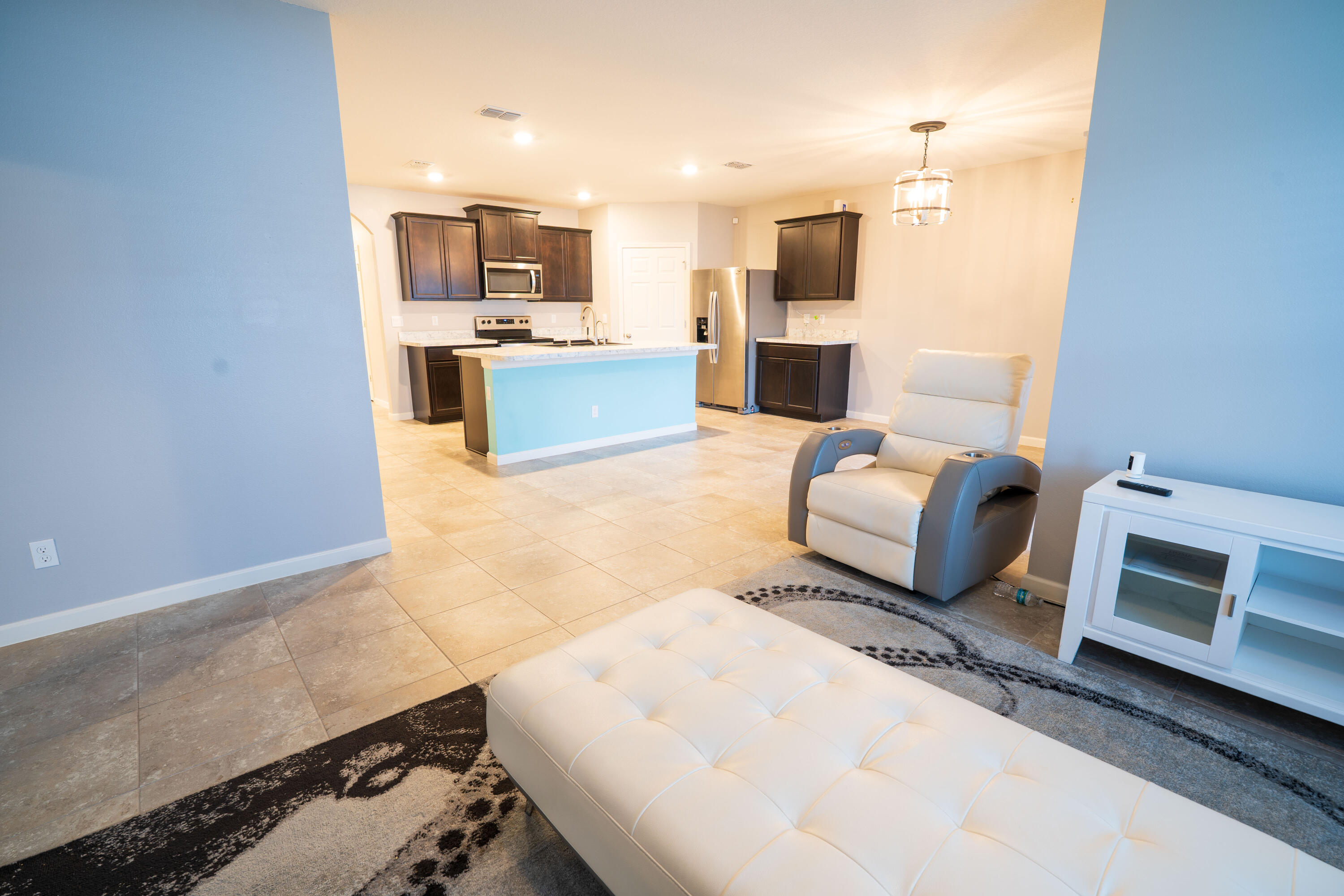 1401 Southeast Portillo Road Port St. Lucie, FL 34952 - Photo 24 of 37 a living room with furniture and a fireplace
