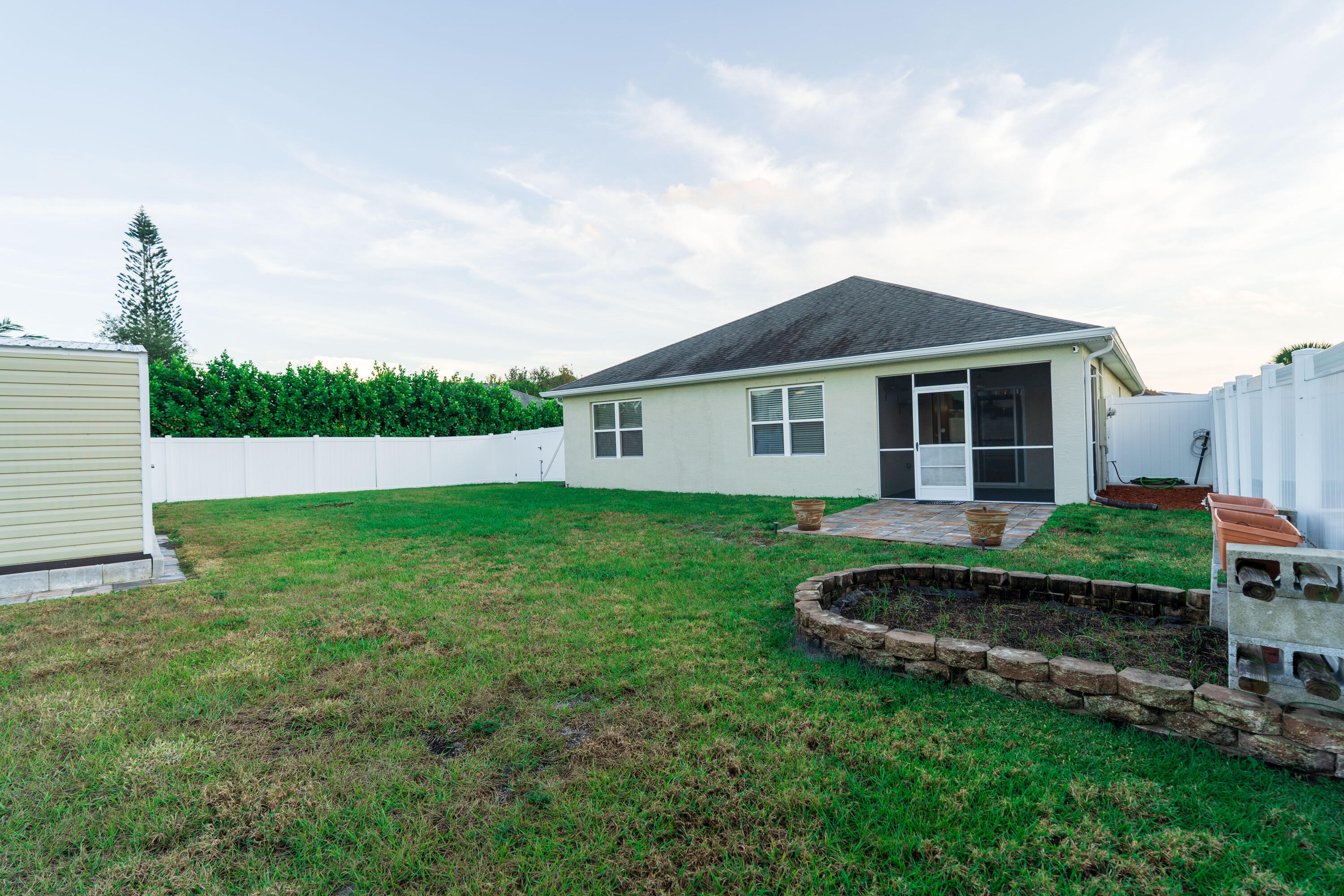 1401 Southeast Portillo Road Port St. Lucie, FL 34952 - Photo 28 of 37 a view of backyard of the house