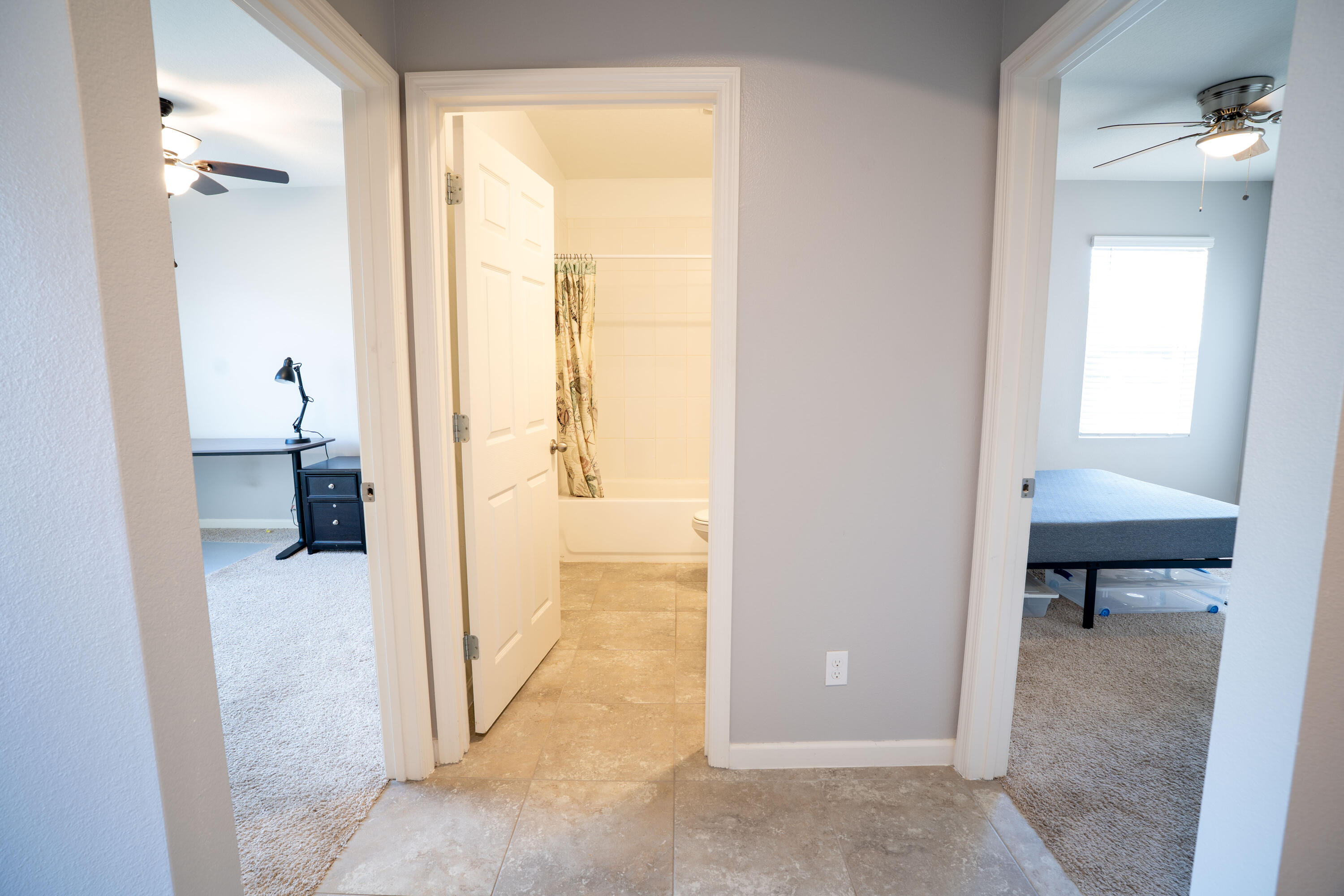 1401 Southeast Portillo Road Port St. Lucie, FL 34952 - Photo 3 of 37 a view of a bathroom from a hallway
