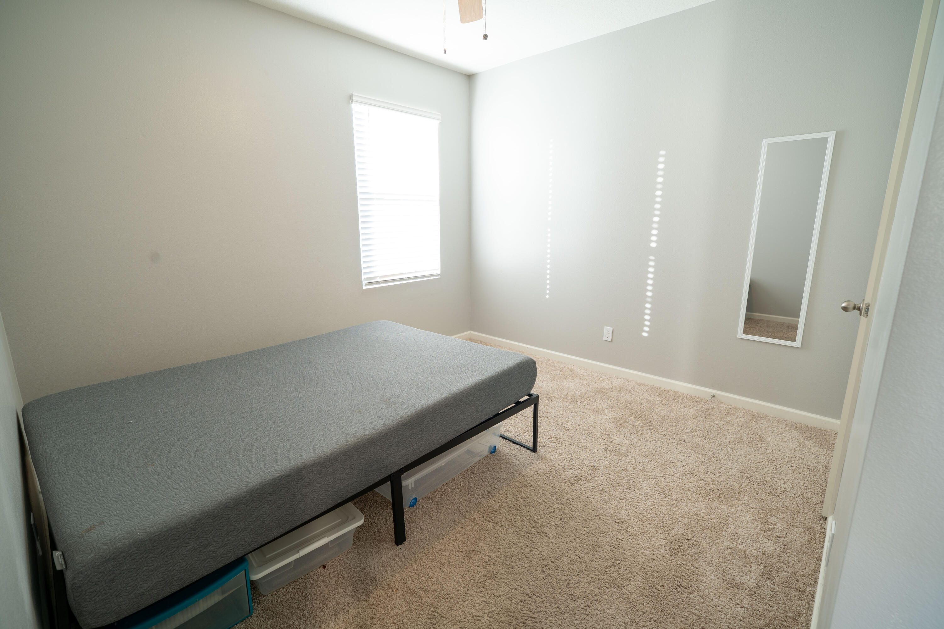 1401 Southeast Portillo Road Port St. Lucie, FL 34952 - Photo 6 of 37 a room with a bed and a window