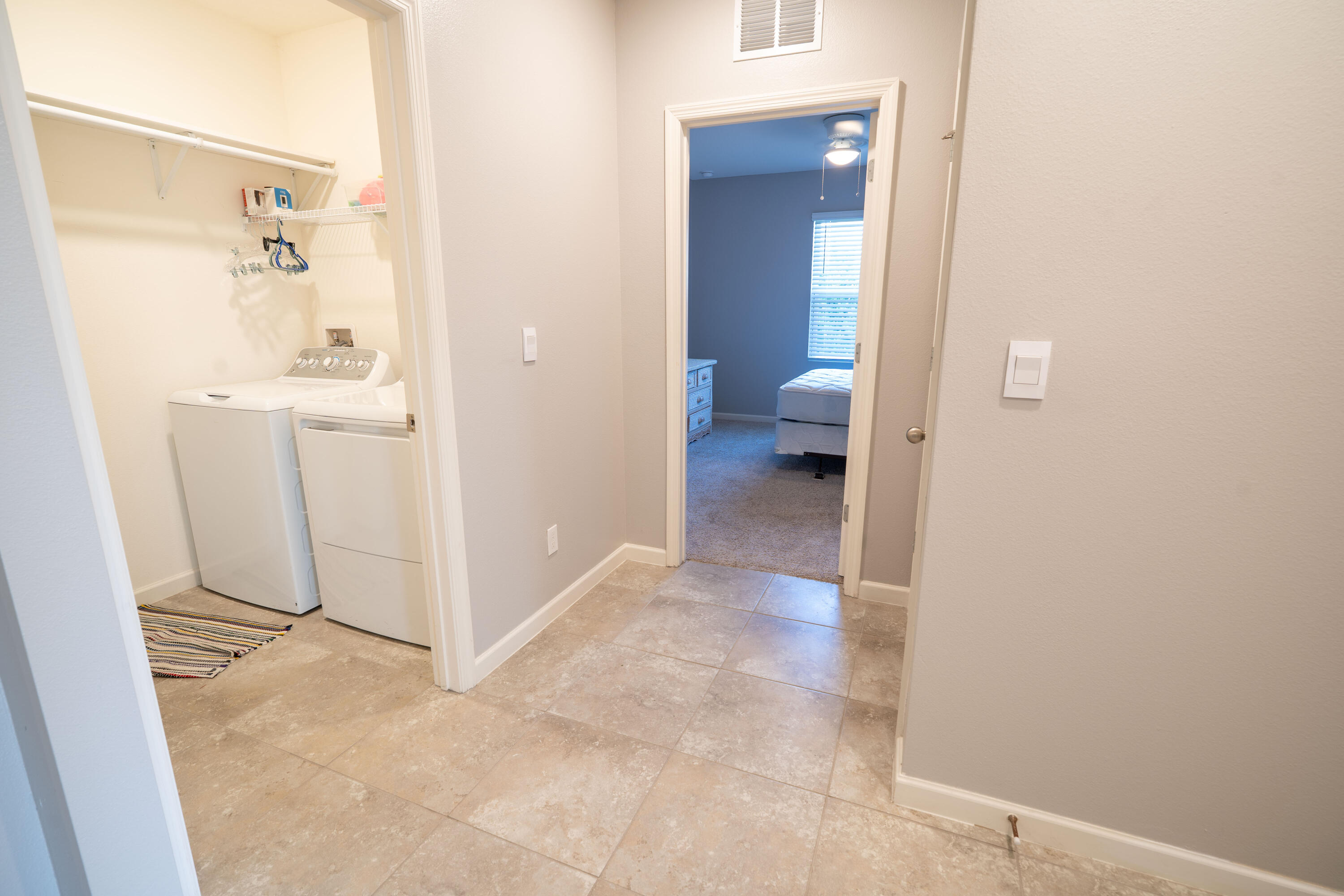 1401 Southeast Portillo Road Port St. Lucie, FL 34952 - Photo 8 of 37 a view of a bathroom from a hallway