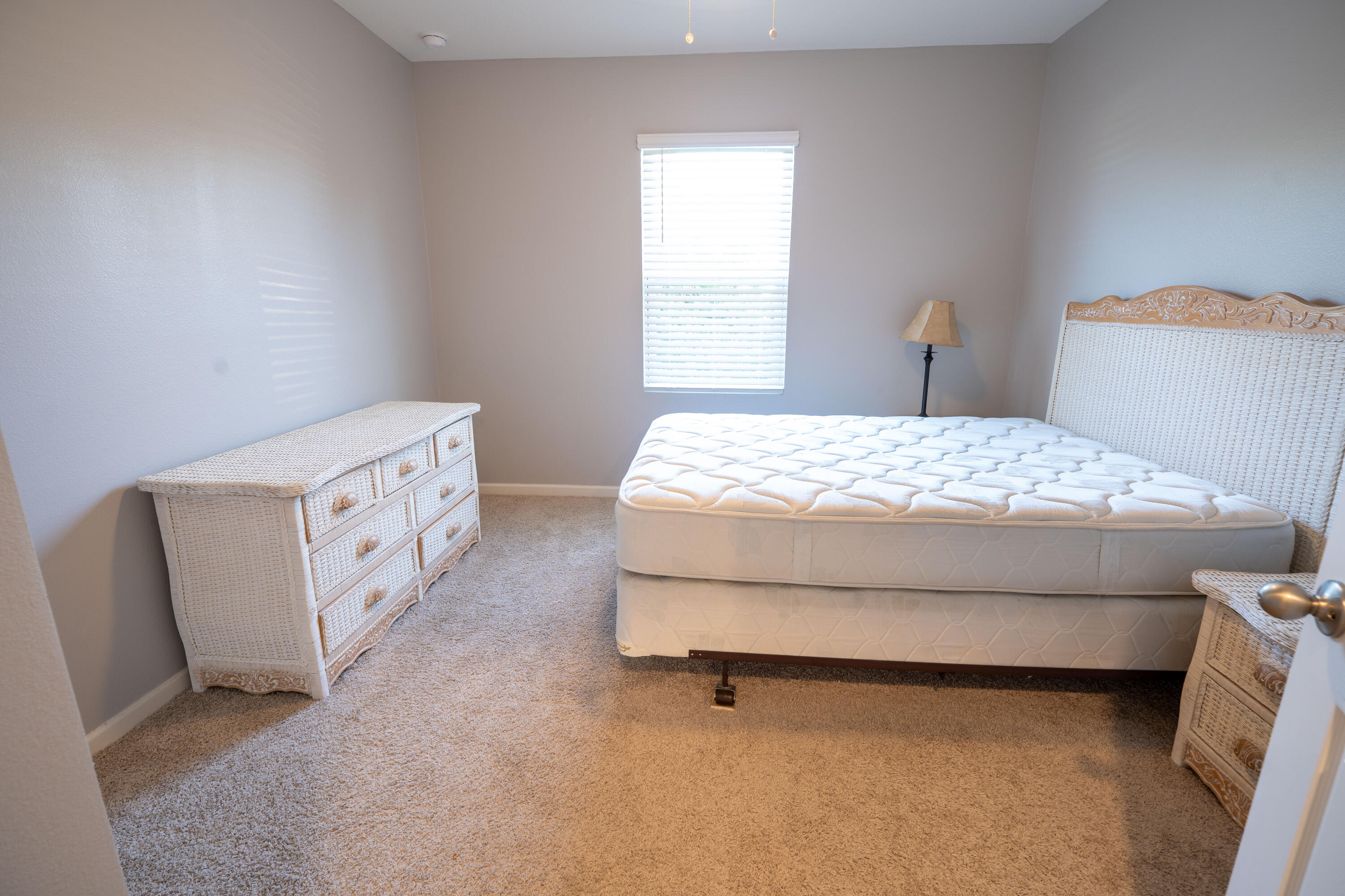 1401 Southeast Portillo Road Port St. Lucie, FL 34952 - Photo 9 of 37 a bedroom with a bed and a window