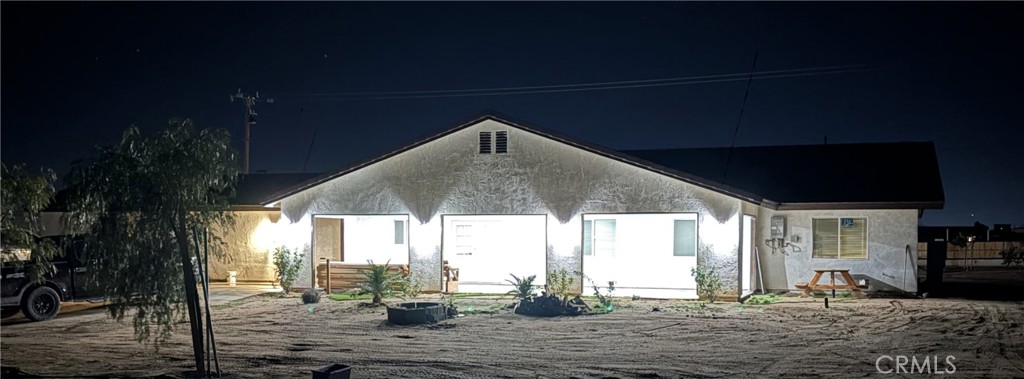 14426 Tumbleweed Road Phelan, CA 92371 - Photo 30 of 38 a front view of a house with sitting area