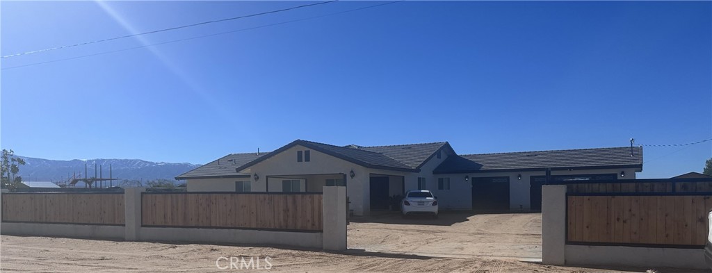 14426 Tumbleweed Road Phelan, CA 92371 - Photo 3 of 38 a front view of a house with a yard