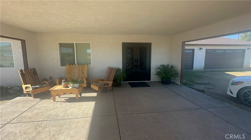 14426 Tumbleweed Road Phelan, CA 92371 - Photo 6 of 38 a living room with furniture and a potted plant