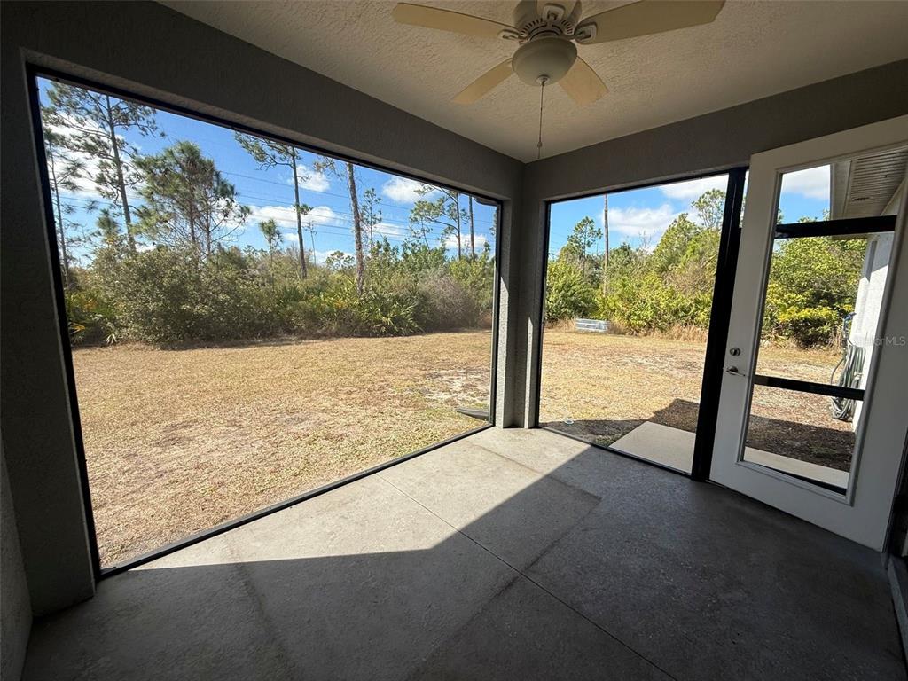 26265 Explorer Road Punta Gorda, FL 33983 - Photo 14 of 15 a view of an empty room with a large window
