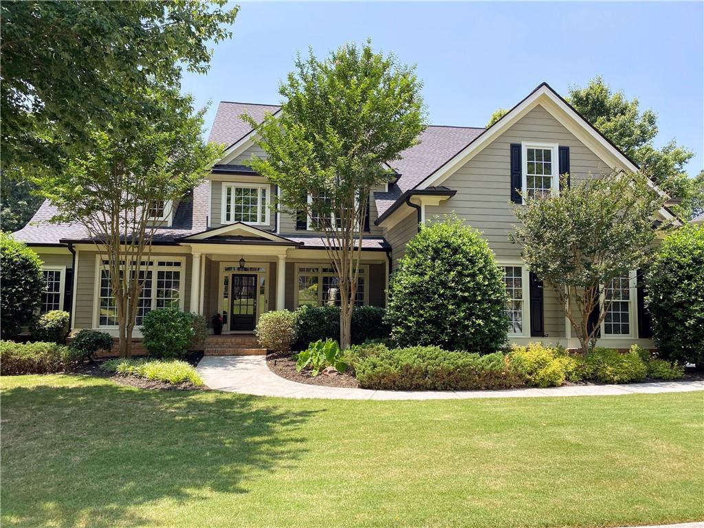 a front view of a house with a yard
