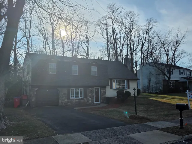 a view of house with yard