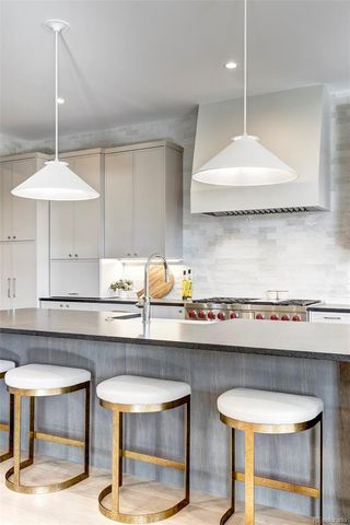 a kitchen with a table and chairs in it