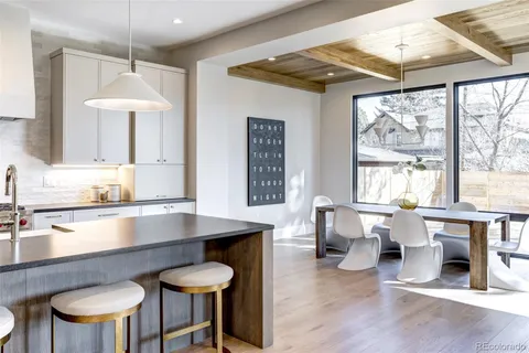 a kitchen with a table and chairs in it