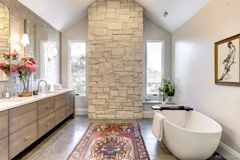 a spacious bathroom with a bathtub and sink