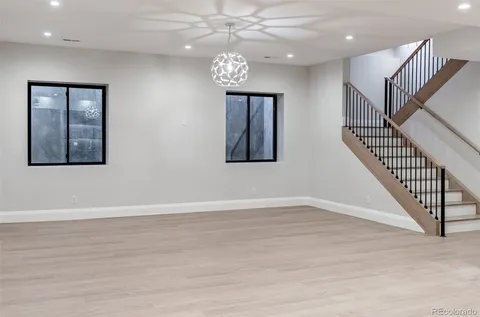 a view of an entryway with wooden floor