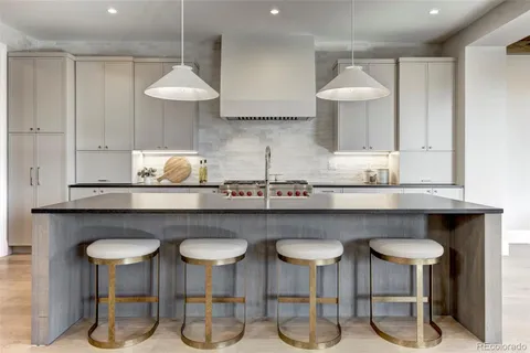 a kitchen with a table and chairs in it