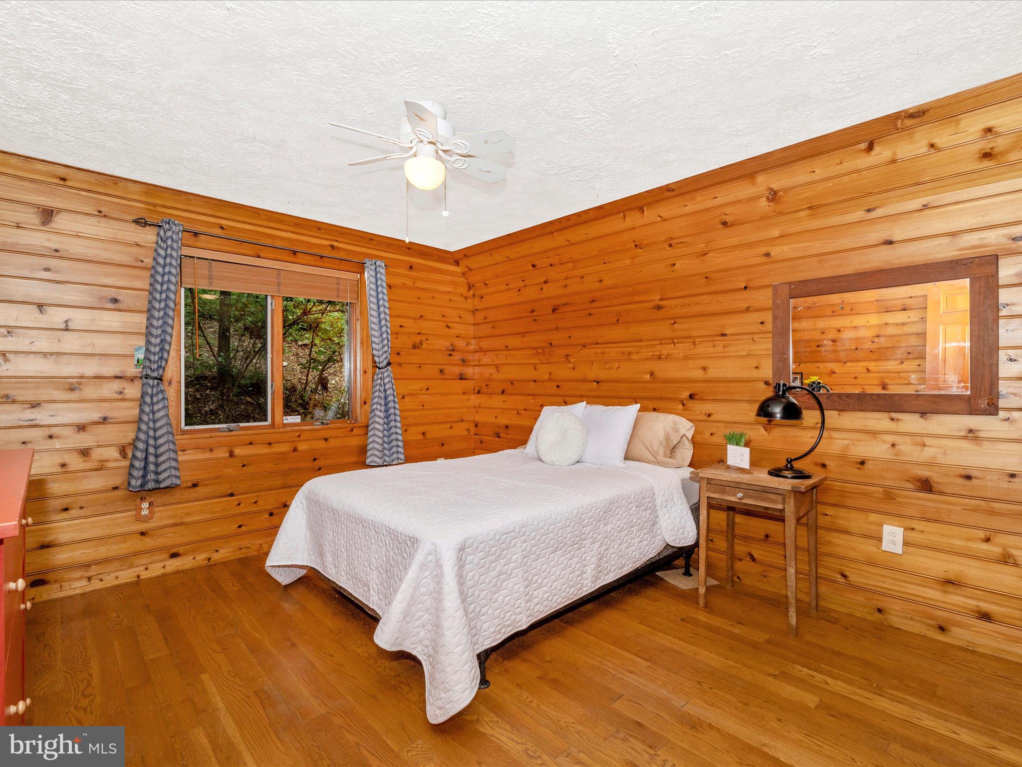 6838 Mountain Church Road Middletown, MD 21769 - Photo 23 of 55 a bedroom with a bed and wooden floor