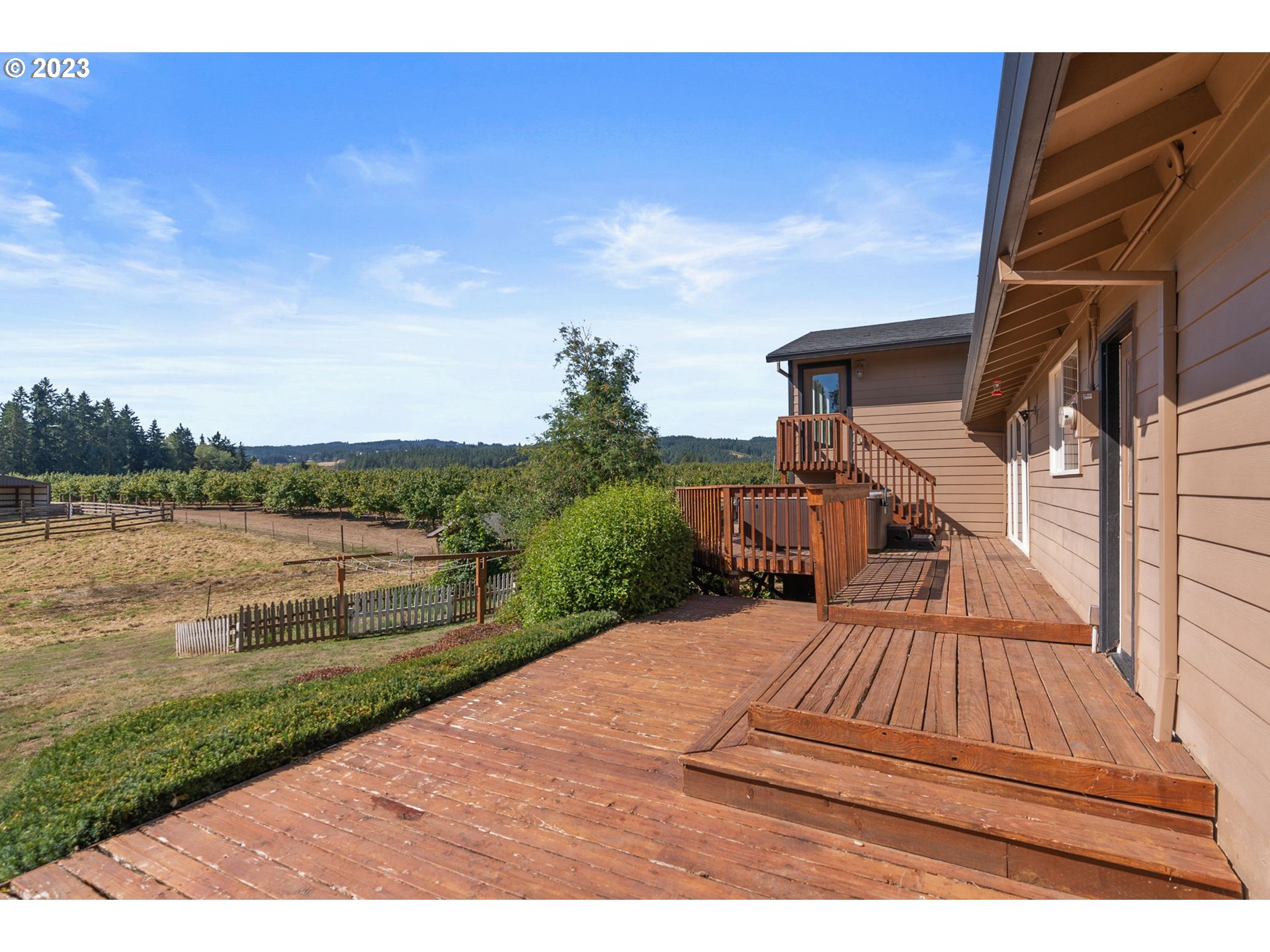 31170 Southwest Firdale Road Cornelius, OR 97113 - Photo 34 of 46 a view of a wooden deck and lake view