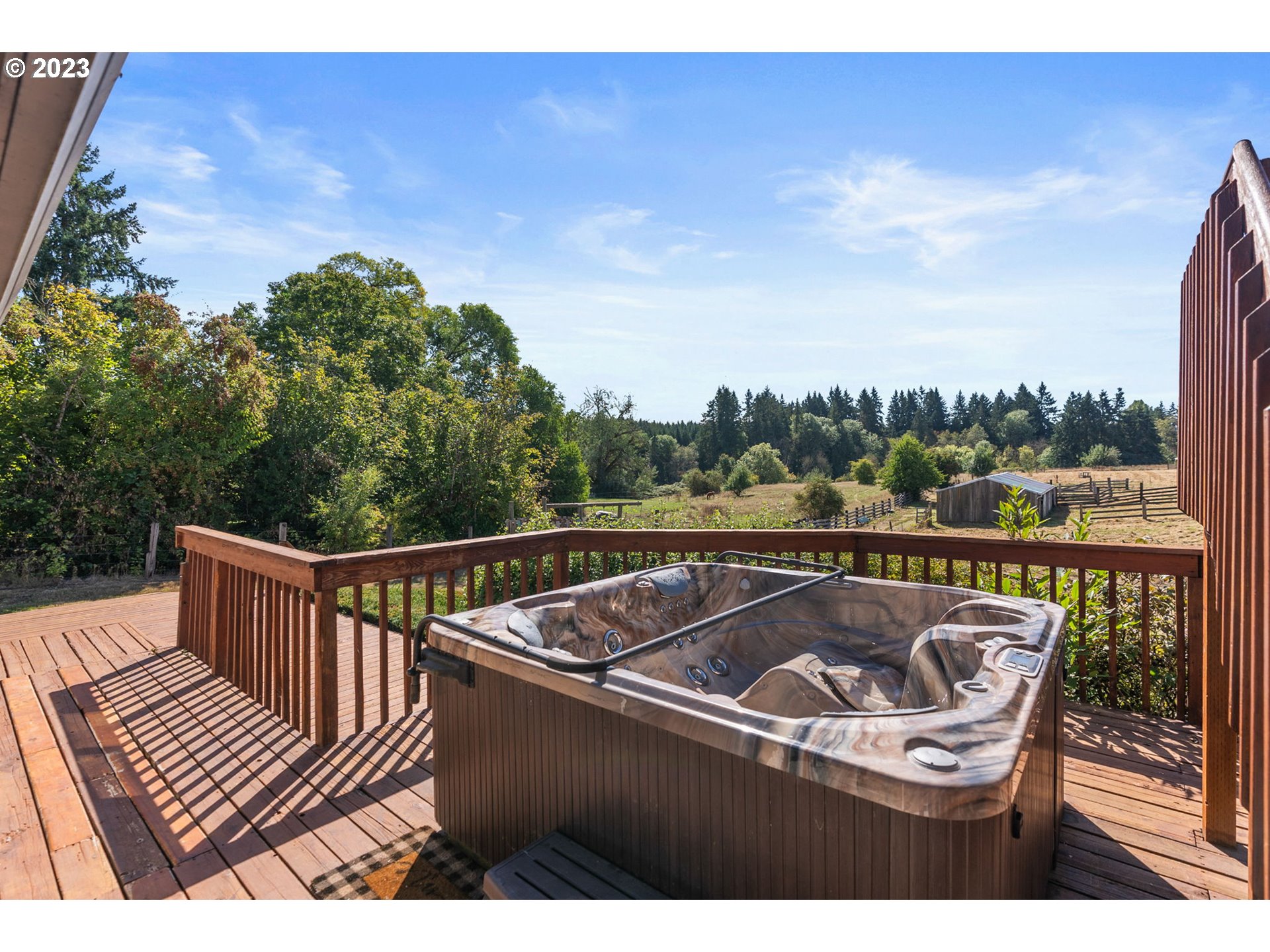31170 Southwest Firdale Road Cornelius, OR 97113 - Photo 35 of 46 a view of a roof deck with two chairs and a table