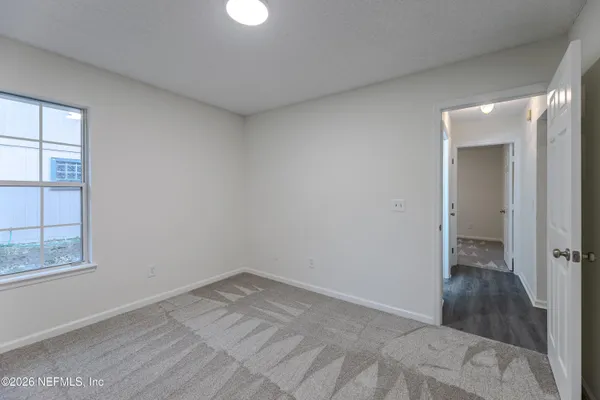 a view of an empty room and window