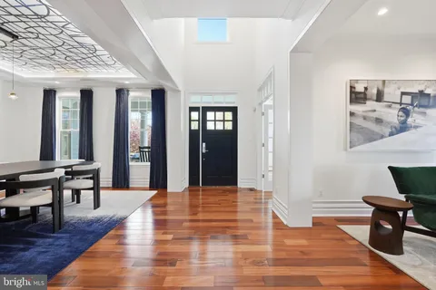a view of a livingroom with furniture and wooden floor