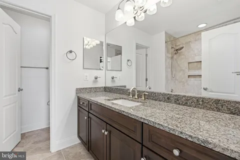 a view of a house with pool and trees in the background