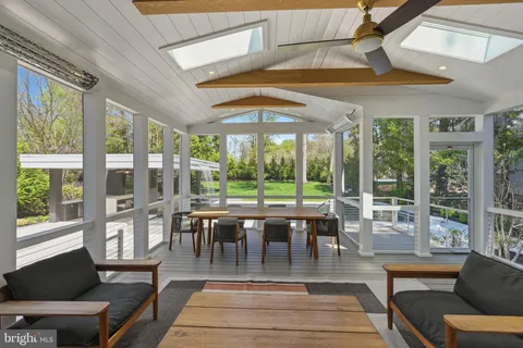 a view of a patio with swimming pool table and chairs