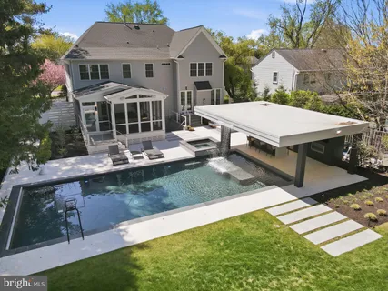 a view of a patio with table and chairs with wooden floor and fence