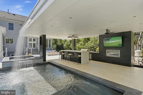 a view of a pathway with potted plants