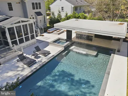 a view of a garden with a house