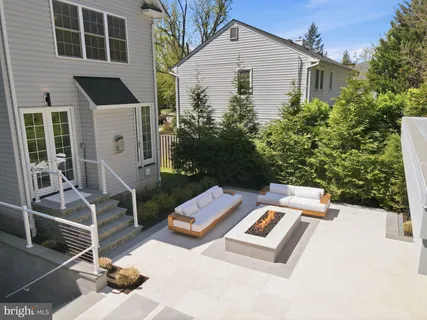 front view of a brick house with a yard