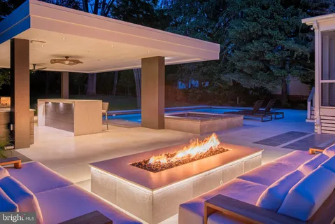 a picture of a room with a white wall and has a painting